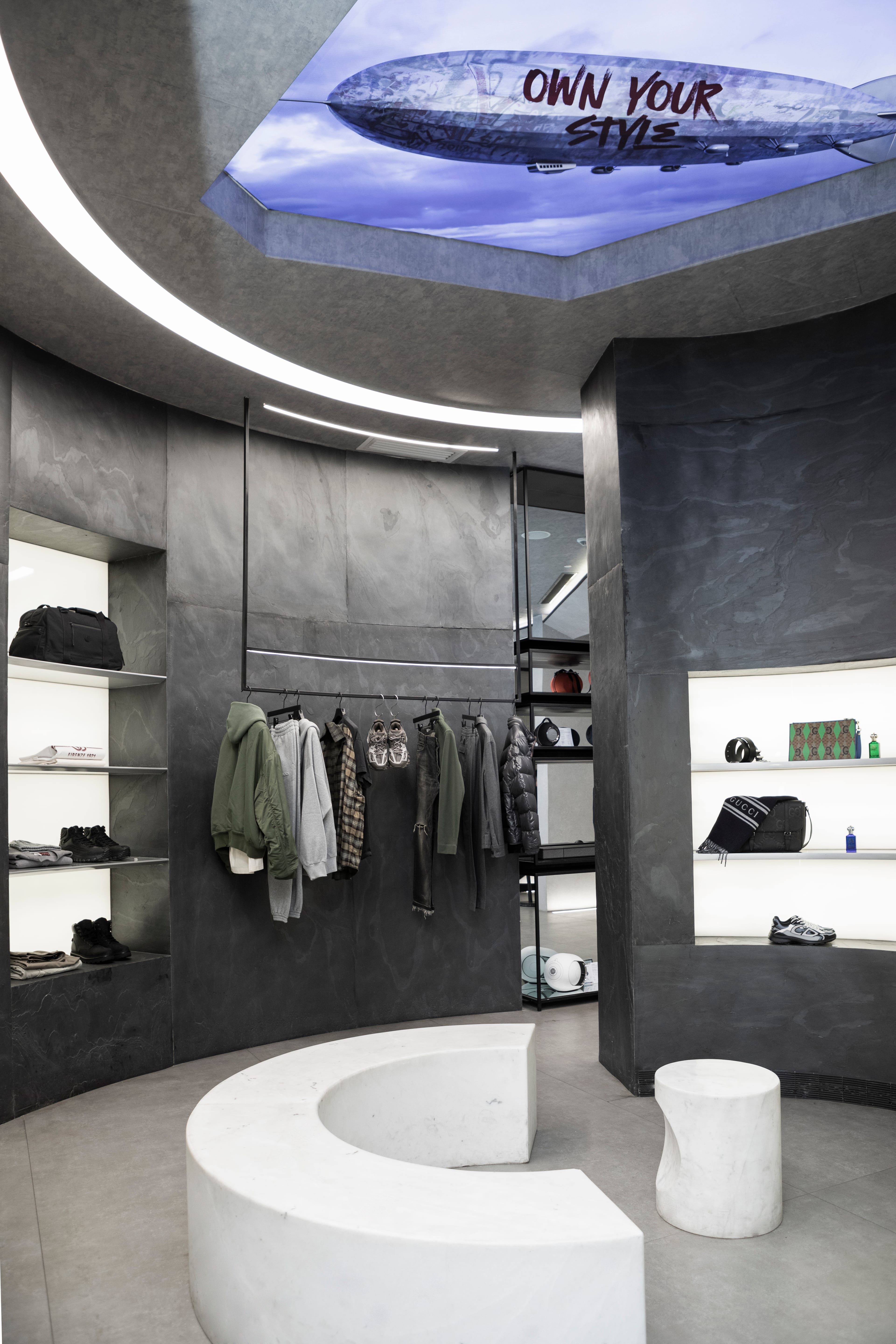 Circular display area with dark garments and shoes